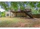 Home features a large deck and fenced backyard with mature trees at 113 Willow Hill Ln, Stockbridge, GA 30281