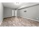 Spacious basement with wood-look tile floors and neutral walls at 113 Willow Hill Ln, Stockbridge, GA 30281