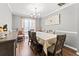 Formal dining room with a large table and hardwood floors at 113 Willow Hill Ln, Stockbridge, GA 30281