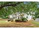 Side view of house showcasing landscaping and a tree-lined setting at 113 Willow Hill Ln, Stockbridge, GA 30281