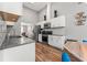 Modern kitchen with white cabinets, granite counters, and stainless steel appliances at 113 Willow Hill Ln, Stockbridge, GA 30281