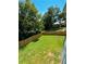 Spacious backyard with a wooden privacy fence and lush lawn at 1705 Nw Mary George Ave, Atlanta, GA 30318