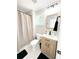 Clean bathroom with a modern vanity and shower/tub combo at 1705 Nw Mary George Ave, Atlanta, GA 30318