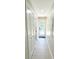 Bright hallway with light flooring and access to backyard at 1705 Nw Mary George Ave, Atlanta, GA 30318