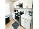 Modern kitchen with white shaker cabinets and stainless steel appliances at 1705 Nw Mary George Ave, Atlanta, GA 30318