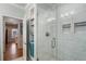 Clean bathroom with marble tile and a linen closet at 1752 Ridgeway Nw Ave, Atlanta, GA 30318