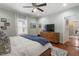 Cozy bedroom with hardwood floors and built-in shelving at 1752 Ridgeway Nw Ave, Atlanta, GA 30318