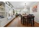 Spacious dining area with built-in shelving and a view to the living room at 1752 Ridgeway Nw Ave, Atlanta, GA 30318