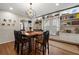 Bright dining room with built-in window seat and hardwood floors at 1752 Ridgeway Nw Ave, Atlanta, GA 30318