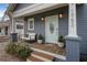 Inviting front porch with light blue door and comfy seating area at 1752 Ridgeway Nw Ave, Atlanta, GA 30318