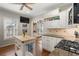 Open kitchen showcasing white cabinets and a kitchen island at 1752 Ridgeway Nw Ave, Atlanta, GA 30318