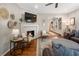 Living room with fireplace, built-in shelving, and hardwood floors at 1752 Ridgeway Nw Ave, Atlanta, GA 30318