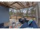 Outdoor deck with pergola, seating, and view of trees at 1752 Ridgeway Nw Ave, Atlanta, GA 30318