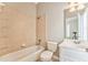 Clean bathroom with a bathtub, toilet and vanity at 6037 Addington Nw Dr, Acworth, GA 30101