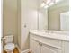 Bathroom with single sink vanity and toilet at 6037 Addington Nw Dr, Acworth, GA 30101