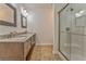 Bathroom with double sinks, granite countertop and shower at 6037 Addington Nw Dr, Acworth, GA 30101