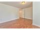 Spacious bedroom with hardwood floors and access to hallway at 6037 Addington Nw Dr, Acworth, GA 30101