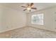 Well-lit bedroom with neutral carpeting and window at 6037 Addington Nw Dr, Acworth, GA 30101