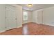 Simple bedroom with hardwood floors and closets at 6037 Addington Nw Dr, Acworth, GA 30101