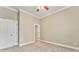 Spacious bedroom with ceiling fan and plush carpeting at 6037 Addington Nw Dr, Acworth, GA 30101