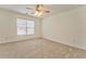 Bright bedroom featuring neutral walls and carpeting at 6037 Addington Nw Dr, Acworth, GA 30101