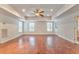 Bright bonus room with hardwood floors and ceiling fan at 6037 Addington Nw Dr, Acworth, GA 30101