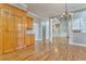 Hardwood floors, chandelier, and view into living room and kitchen at 6037 Addington Nw Dr, Acworth, GA 30101