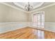 Elegant dining room with hardwood floors, wainscoting, and large windows at 6037 Addington Nw Dr, Acworth, GA 30101