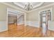 Formal dining room boasts hardwood floors and a chandelier at 6037 Addington Nw Dr, Acworth, GA 30101