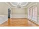 Formal dining room with hardwood floors, wainscoting, and built-in at 6037 Addington Nw Dr, Acworth, GA 30101