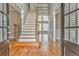 Bright entryway with hardwood floors and a view of the staircase at 6037 Addington Nw Dr, Acworth, GA 30101