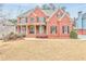 Two story home with front porch and landscaping at 6037 Addington Nw Dr, Acworth, GA 30101