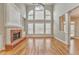 Bright Gathering room boasts hardwood floors and a brick fireplace at 6037 Addington Nw Dr, Acworth, GA 30101