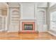 Gathering room features built-in shelving and brick fireplace at 6037 Addington Nw Dr, Acworth, GA 30101