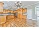 Kitchen with hardwood floors, granite island and wood cabinets at 6037 Addington Nw Dr, Acworth, GA 30101