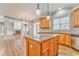 Open kitchen with granite island and view into Gathering room at 6037 Addington Nw Dr, Acworth, GA 30101