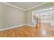 Spacious living room with hardwood floors and view of staircase at 6037 Addington Nw Dr, Acworth, GA 30101