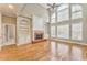 Bright living room with hardwood floors, fireplace, built-in shelves, and high ceilings at 6037 Addington Nw Dr, Acworth, GA 30101