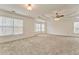 Spacious main bedroom with high ceilings, neutral carpeting, and multiple windows at 6037 Addington Nw Dr, Acworth, GA 30101