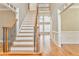 Impressive staircase with wrought iron railing and hardwood floors at 6037 Addington Nw Dr, Acworth, GA 30101