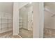 Bright walk-in closet with mirrored doors and wire shelving at 6037 Addington Nw Dr, Acworth, GA 30101