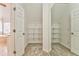 Large walk-in closet with wire shelving and mirrored doors at 6037 Addington Nw Dr, Acworth, GA 30101