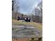 Spacious backyard with a basketball court and mature trees at 103 Live Oak Ct, Dallas, GA 30157