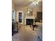 Bright living room featuring a fireplace and large windows at 103 Live Oak Ct, Dallas, GA 30157