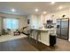 Open concept kitchen with island and stainless steel appliances at 1334 Rogers Landing Rd, Lithonia, GA 30058