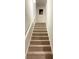 Carpeted staircase leading to upper level at 1334 Rogers Landing Rd, Lithonia, GA 30058