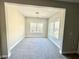 Cozy sitting room with two windows and carpeted floor at 208 Spike Trl, Smyrna, GA 30080