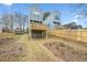 Elevated deck overlooks a grassy backyard with a wooden fence at 550 Paines Nw Ave, Atlanta, GA 30318