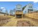 Elevated deck overlooks a grassy backyard with a wooden fence at 550 Paines Nw Ave, Atlanta, GA 30318
