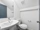 Modern bathroom with white vanity, toilet, and a large mirror at 550 Paines Nw Ave, Atlanta, GA 30318